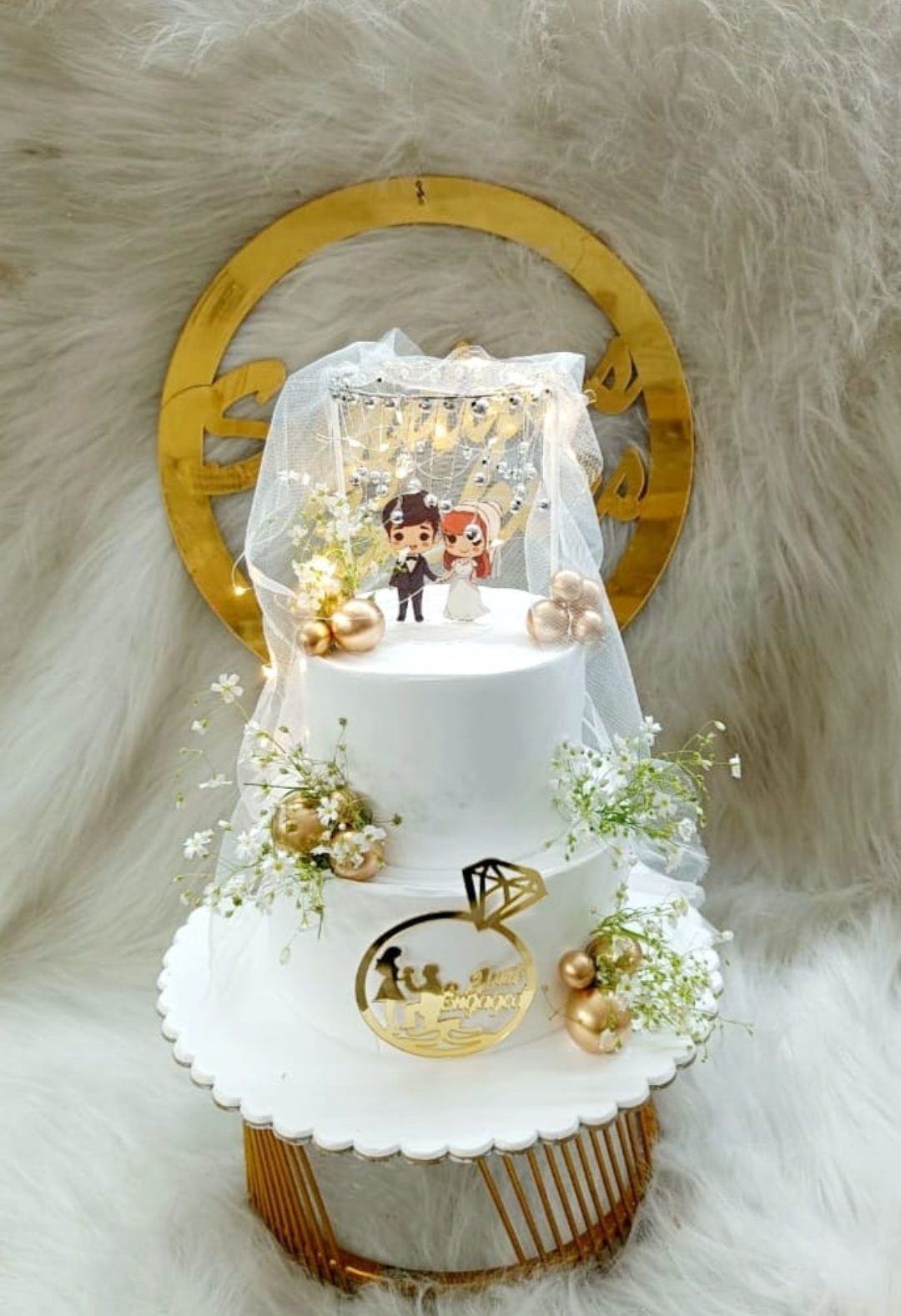 Engagement cake with elegant decorative topper